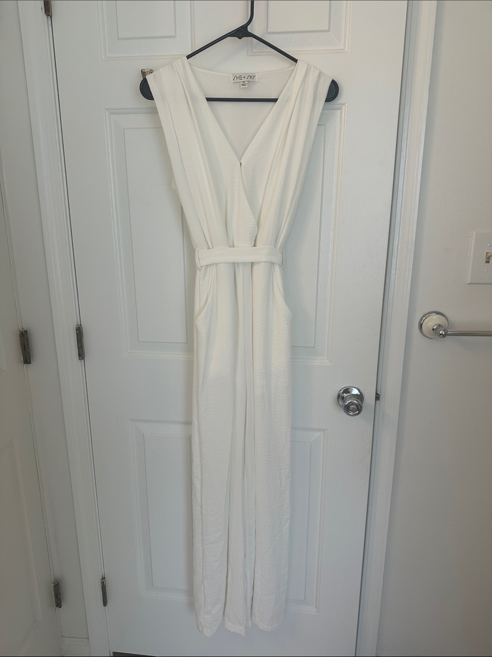 Sleeveless White V-Neck Jumpsuit Dress with Belt